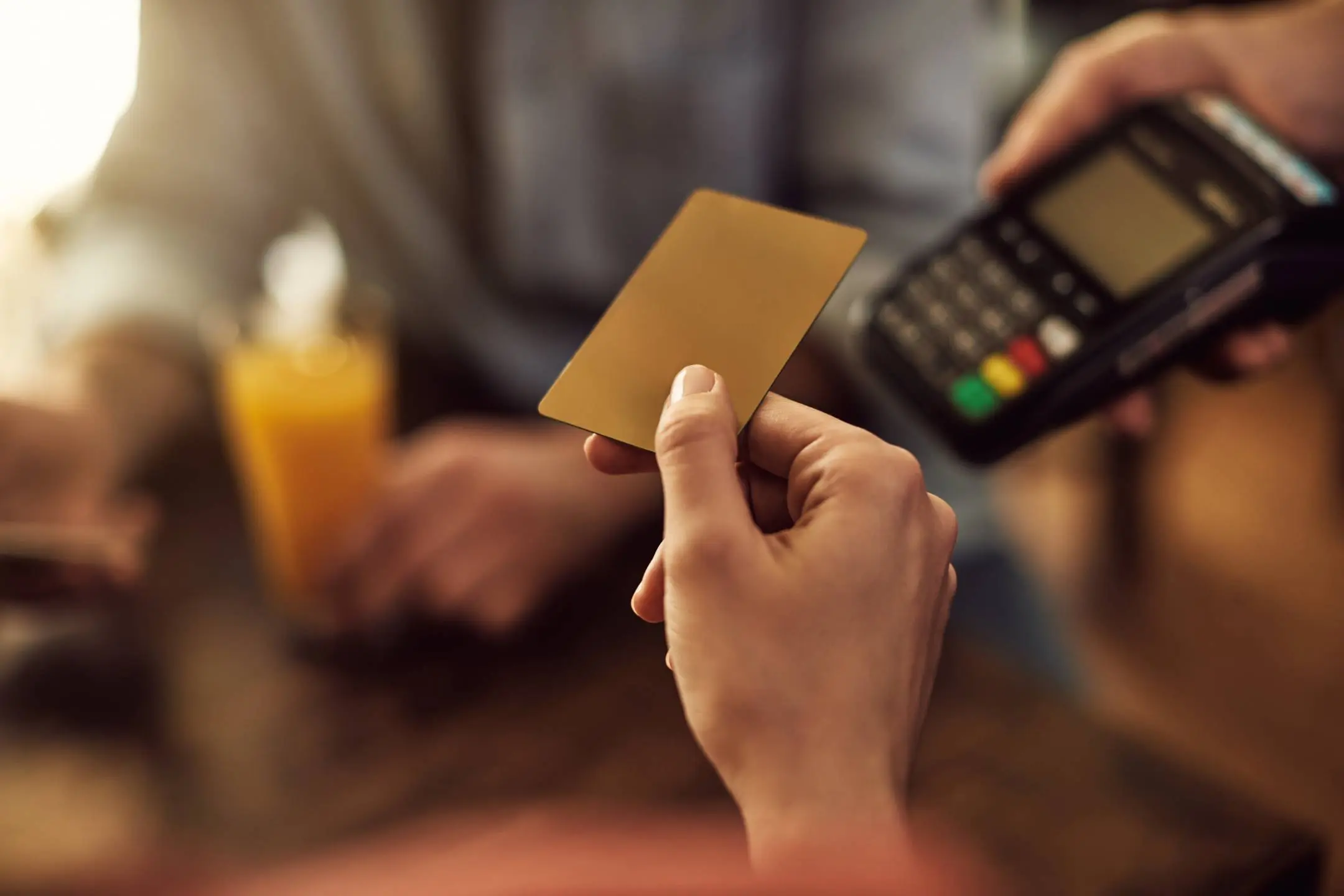 customer using card to make payment at pos terminal