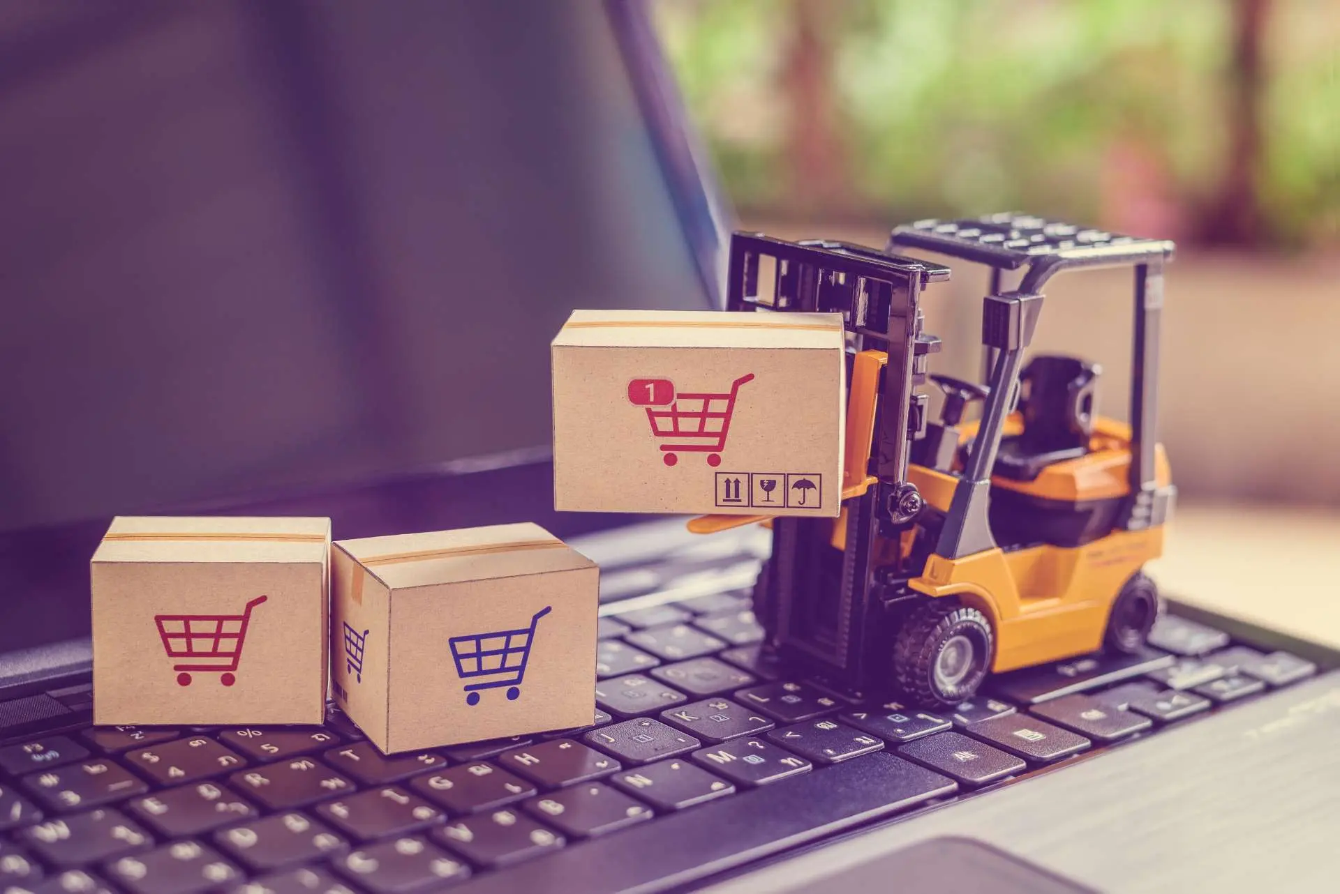 boxes with shopping cart icon being carried for ecommerce strategy