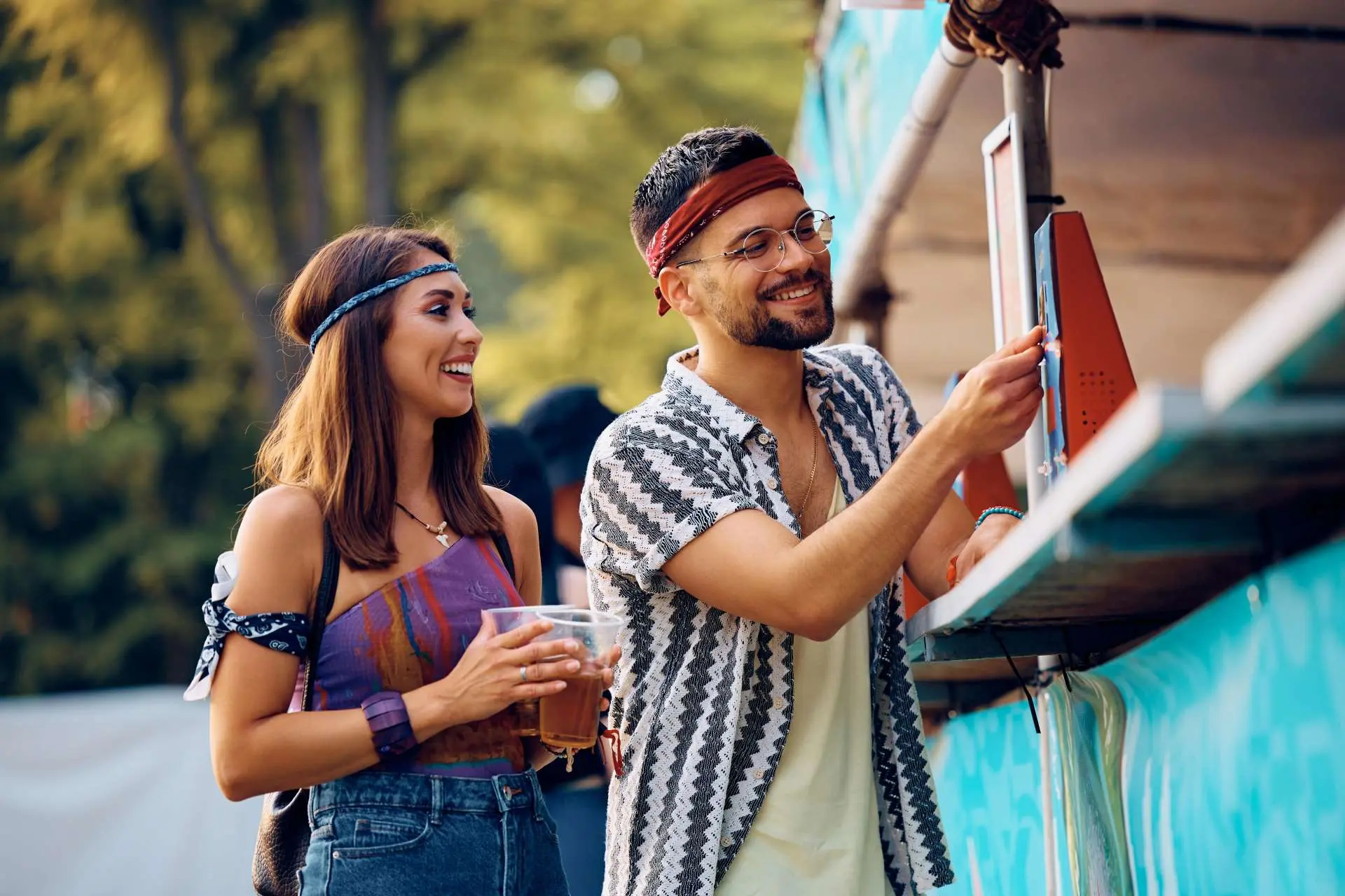 couple using POS system at a festival for seamless payment