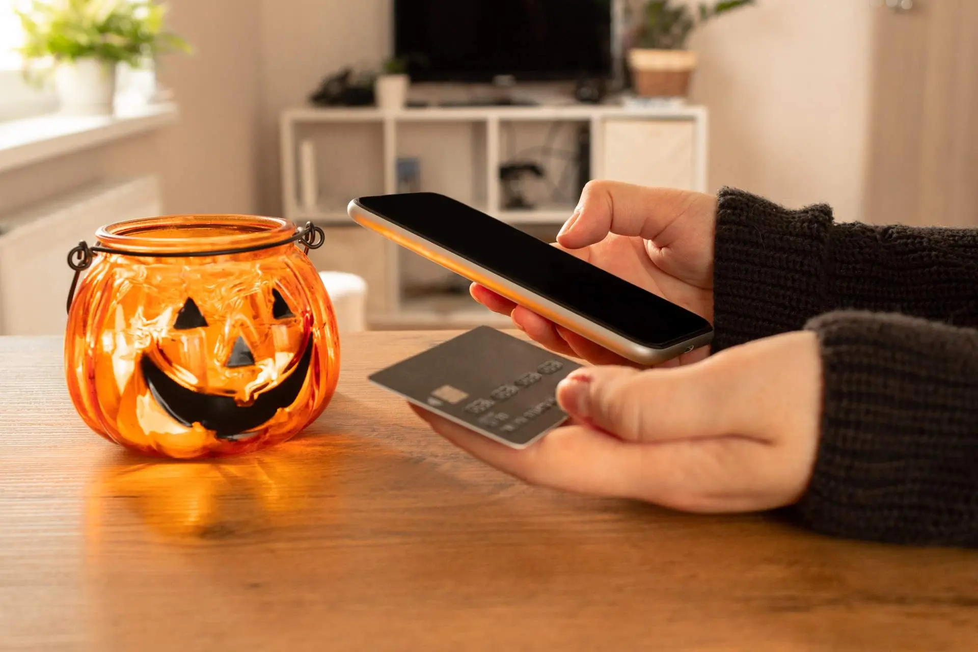 customer paying using mobile payments method for ecommerce customer journey during halloween